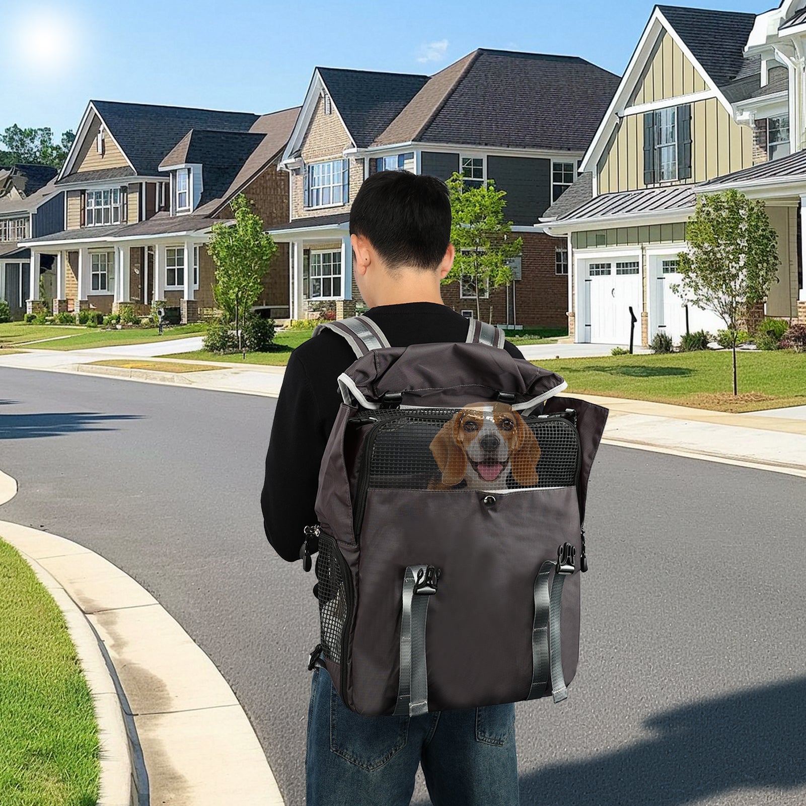 Person walking with a pet backpack containing a dog on a suburban street.