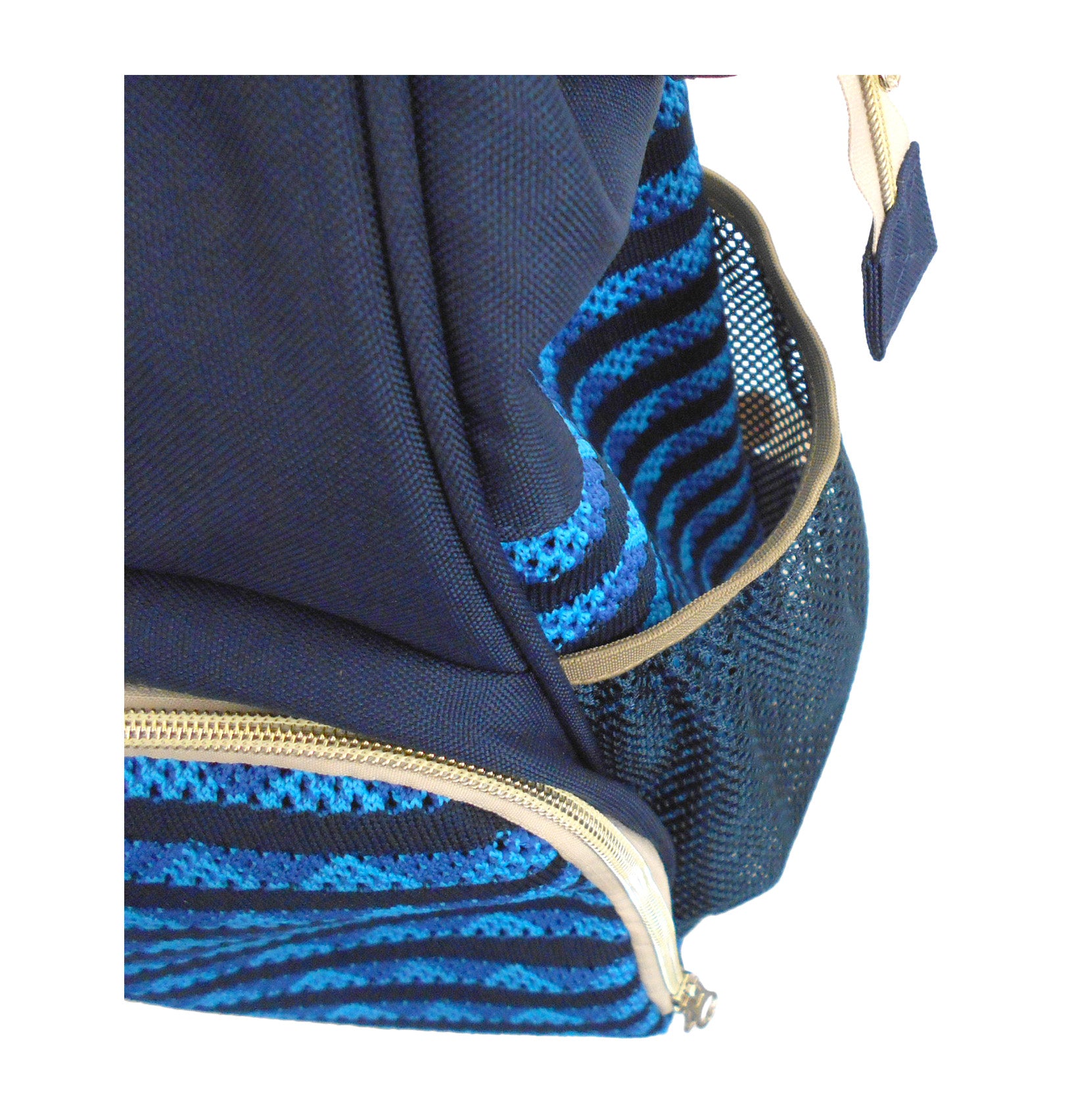 Close-up of a blue pet carrier backpack with zebra pattern lining and gold zipper.