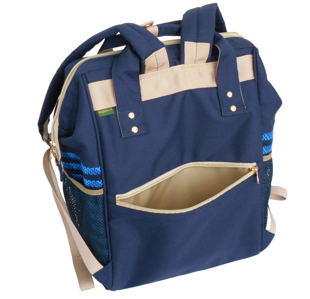 Navy blue pet carrier  backpack with beige accents and blue accents on a white background